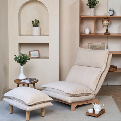 A Single Lazy Sofa Chair Leisure Foldable Reclining Chair in beige with a footrest sits by a small wooden table holding a potted plant and magazines. Nearby, shelves display decor like a globe and framed photo in a softly lit, minimalist room.