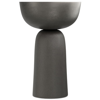 The Hughes Cast Aluminum Side Table in black features a modern design with a round, bowl-shaped top and a tall, textured cylindrical base, shown upright against a plain white background.