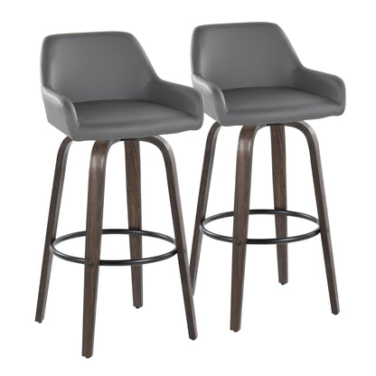 The Daniella barstool set includes two contemporary gray stools with curved padded seats, low backs, armrests, and dark wooden legs. Each fixed-height, swivel stool features a round black metal footrest for added comfort.