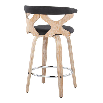 The Gardenia Mid Century Modern Counter Stool (Set of 2) features a light wood frame, curved cut-out backrest, black cushioned seat, four splayed legs, and a circular chrome footrest with fixed height and swivel function.