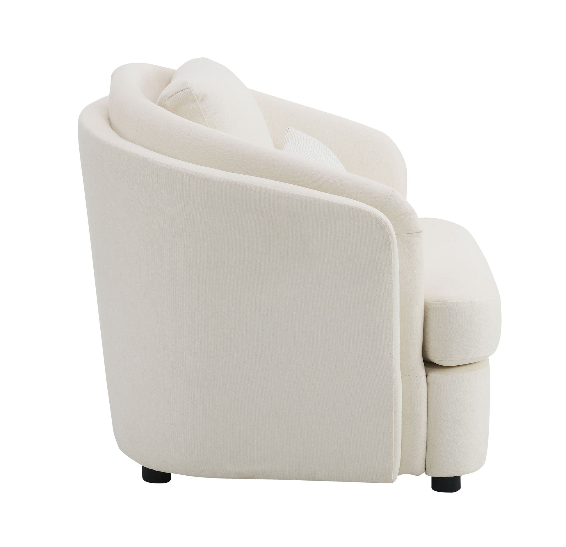 Side view of the Mariko Linen Chair in beige, featuring rounded edges, plush cushioning, short black legs, and a matching toss pillow.