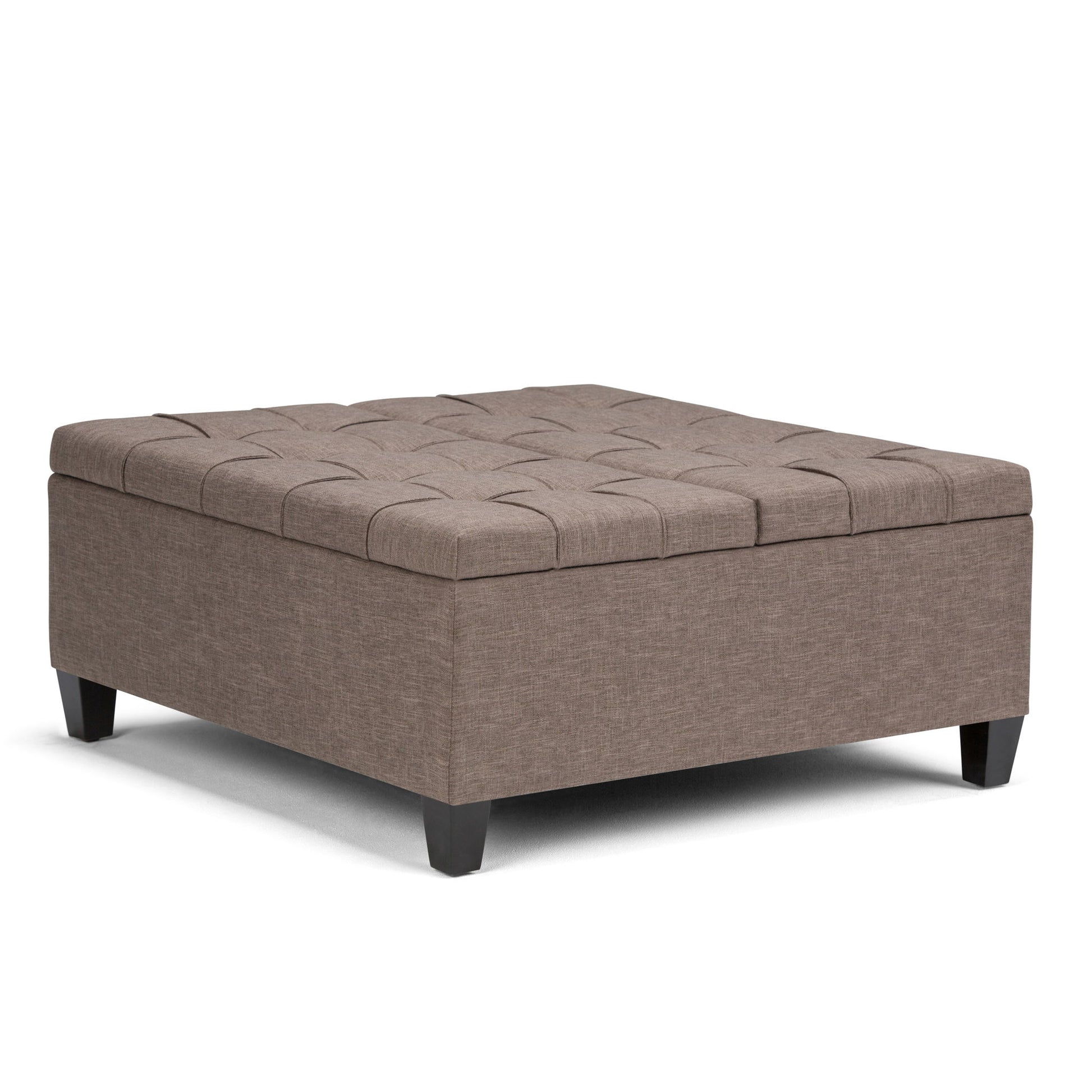 The Harrison Upholstered Coffee Table Storage Ottoman features a rectangular, tufted design in light brown fabric with short, dark wooden legs, shown against a white background.