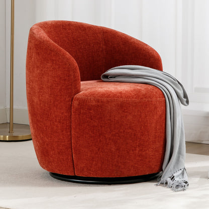 A modern Chenille Fabric Swivel Accent Armchair Barrel Chair with a powder coating metal ring sits on a light rug, draped with a light gray fringed throw blanket, while a gold floor lamp stands near a white curtain in the background.