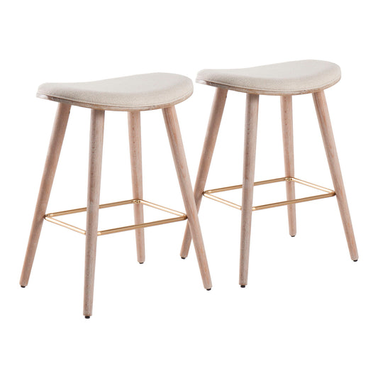 The Saddle - Contemporary Counter Stool (Set of 2) features two modern backless stools with light wood legs, beige curved upholstered seats, and gold metal footrests, displayed against a white background.
