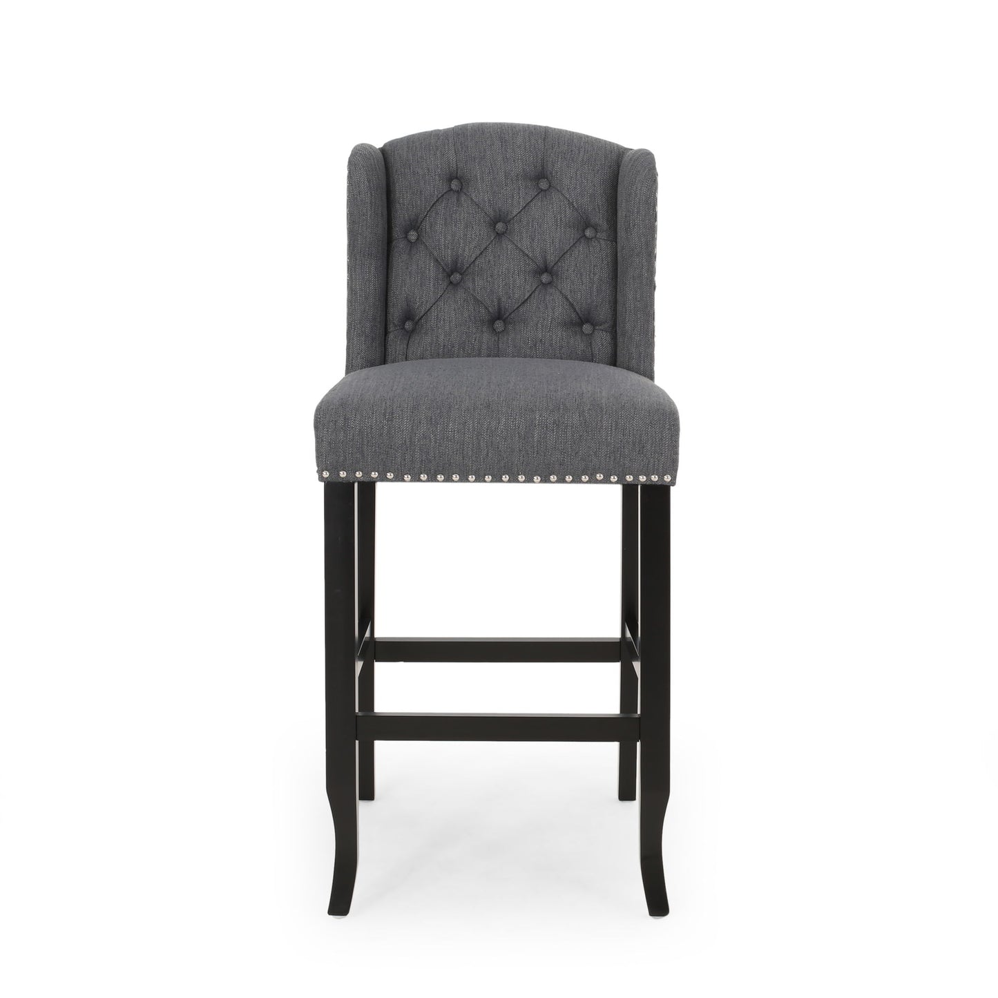 The Vienna Contemporary Fabric Tufted Wingback Counter Stools (Set of 2) features gray upholstery, tufted backrest, silver nailhead trim, and dark wooden legs, shown from the front on a plain white background.