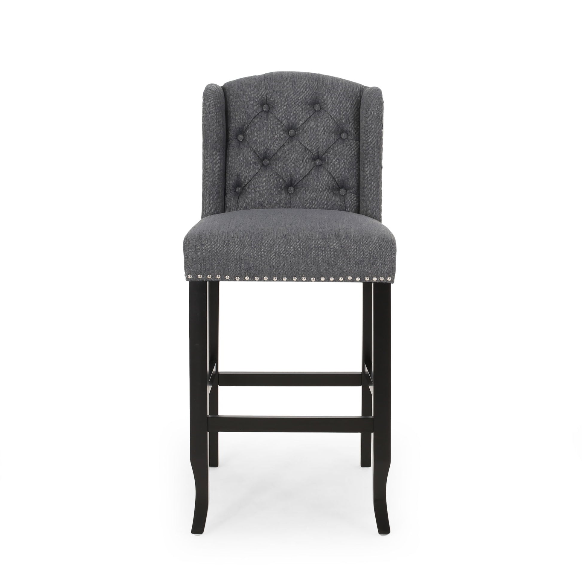 The Vienna Contemporary Fabric Tufted Wingback Counter Stools (Set of 2) features gray upholstery, tufted backrest, silver nailhead trim, and dark wooden legs, shown from the front on a plain white background.
