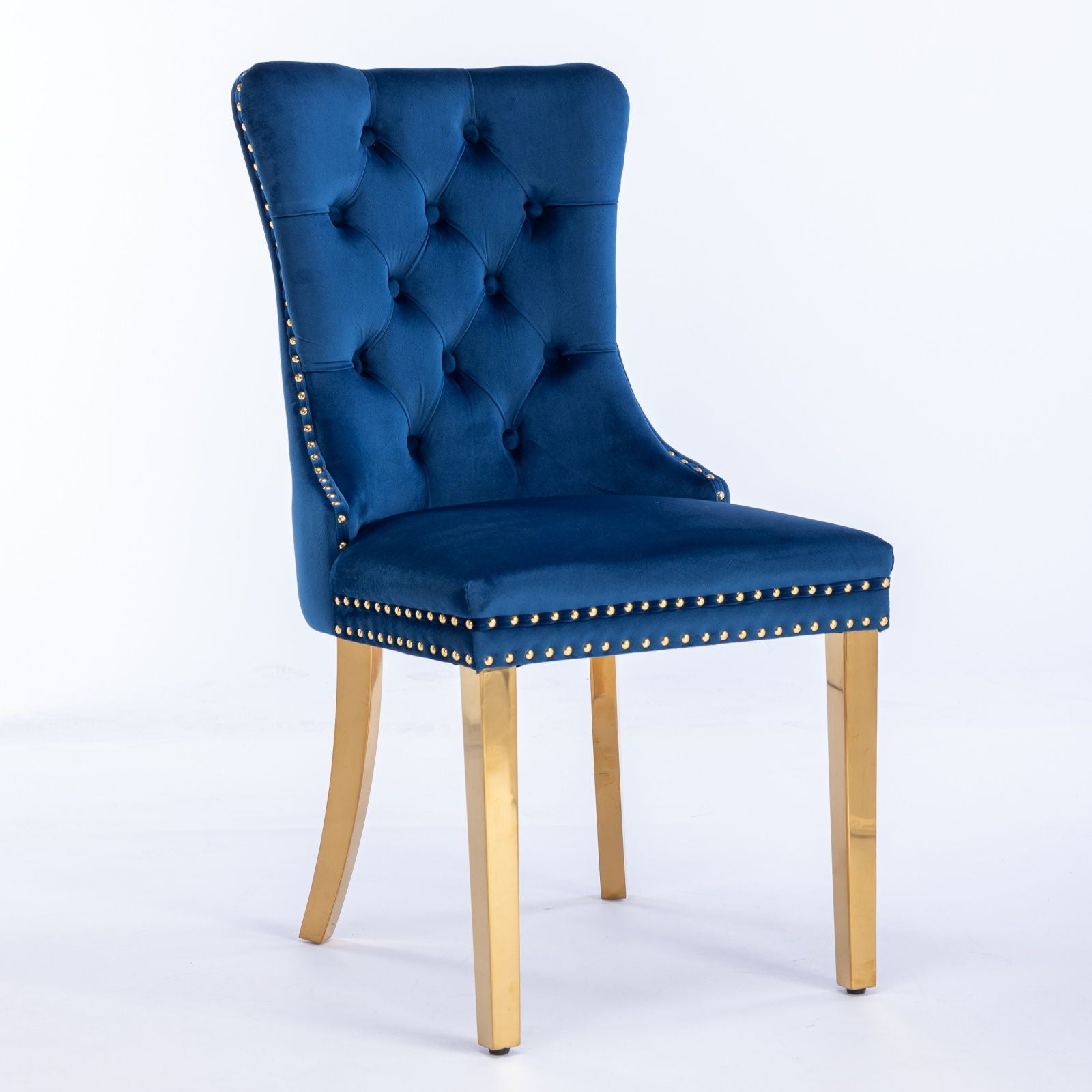 The Nikki modern velvet dining chair set features a tufted back, nailhead trim, and golden stainless steel-plated legs, shown against a plain white background.