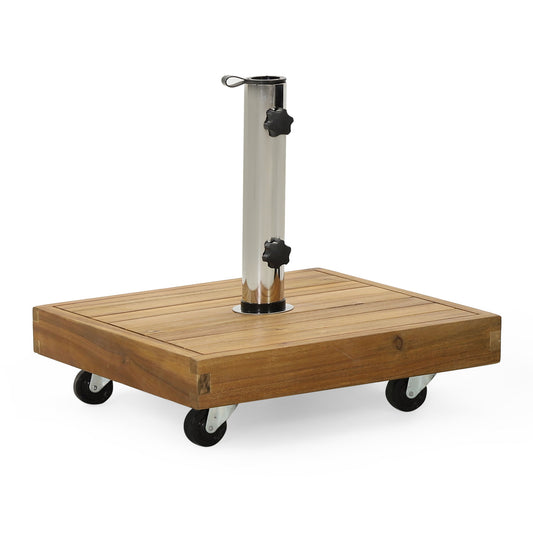 The Ralph Square Umbrella Base in teak features four black caster wheels, a vertical metal pole holder with two adjustment knobs, and a top metal loop handle.