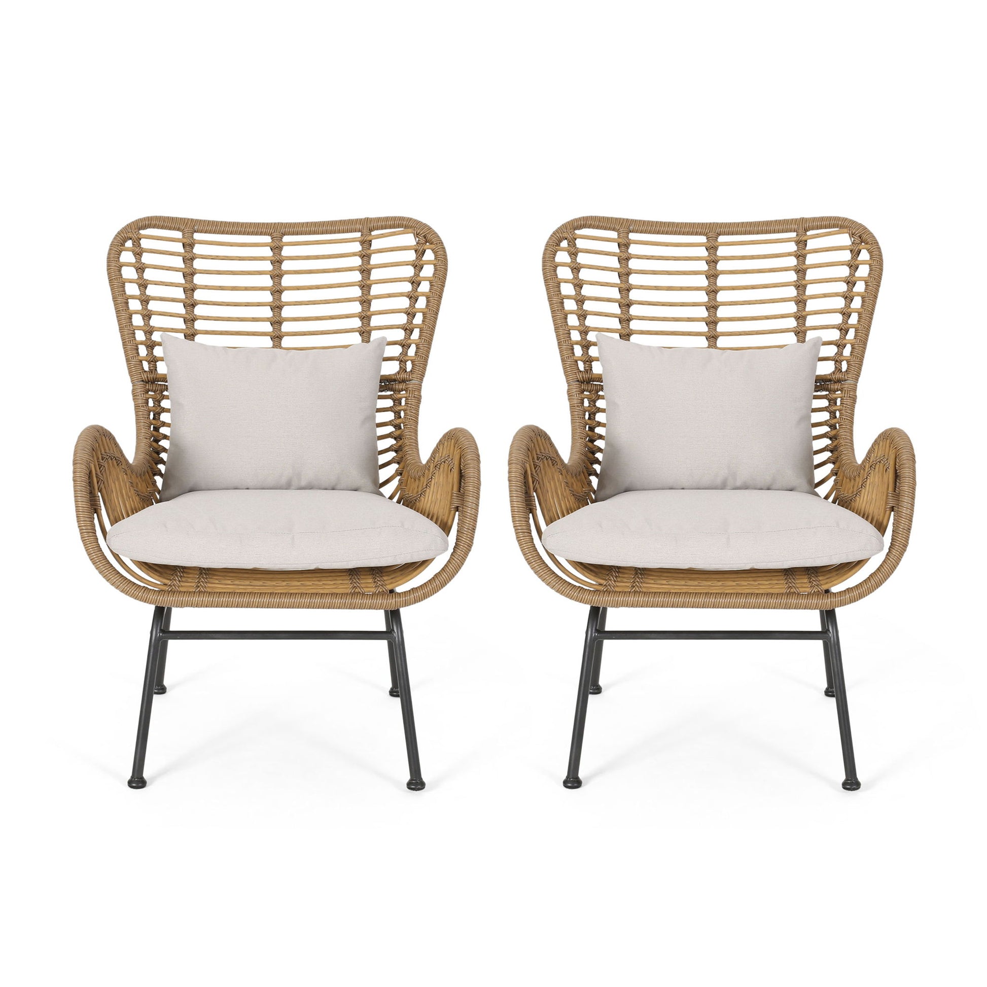 Set of two Modern Aesthetic Outdoor Rattan Accent Chairs with high backs, curved armrests, light beige seat cushions, matching throw pillows, and black metal legs for a stylish, airy look.