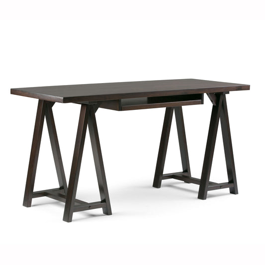 The Sawhorse - Handcrafted Desk features a dark-finished wooden rectangular top, two trestle-style legs per side with horizontal supports, and a centered shallow drawer beneath the desktop.