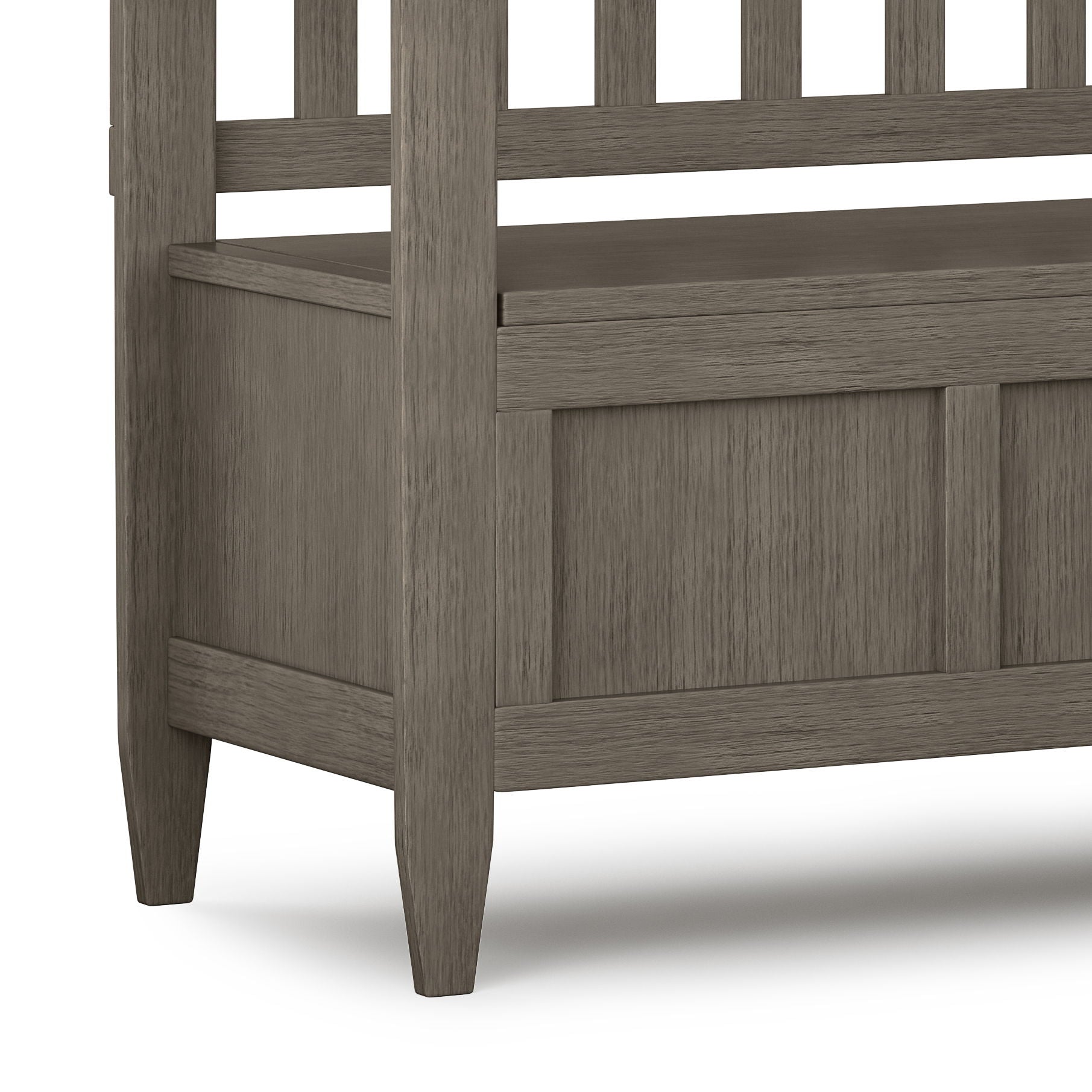 Close-up of the Brooklyn Handcrafted Entryway Storage Bench, featuring a slatted backrest, panel detailing, four legs, a grayish-brown finish, and a lift-top seat for storage.