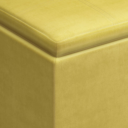 Close-up of the corner of the Rockwood - Upholstered Cube Storage Ottoman With Tray, highlighting its smooth yellow fabric texture and neat top stitching.