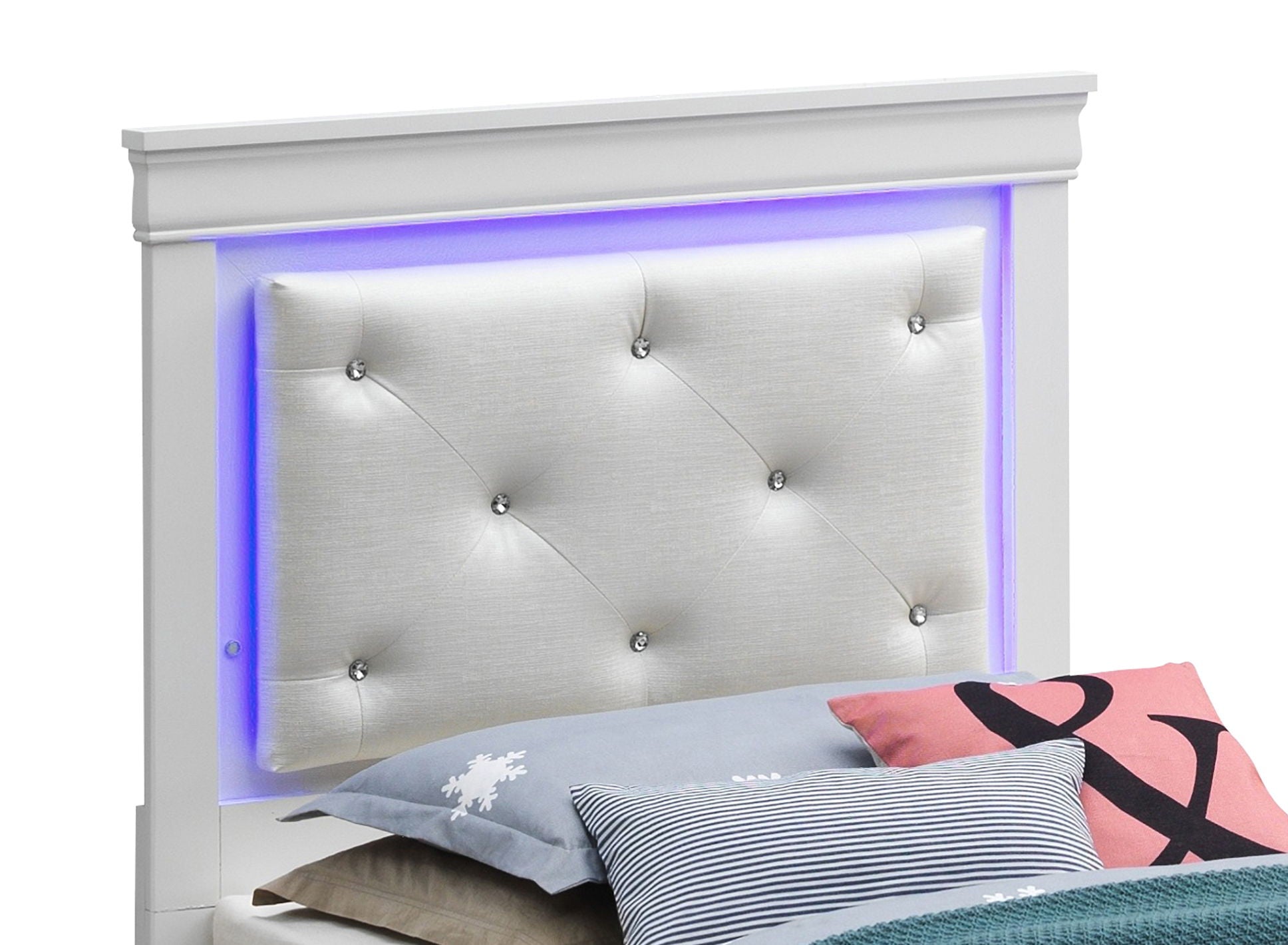 The Lorana - G6590C-FB3 Full Bed in Silver Champagne features a tufted, cushioned white headboard with button accents and soft blue LED lighting, complemented by an array of colorful, patterned pillows.