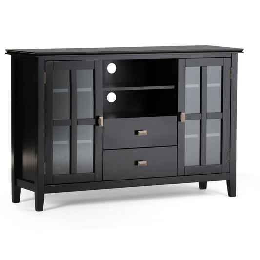 The Artisan - Handcrafted, Tall TV Media Stand features a black wooden build with two glass-paneled doors, an open shelf with cable holes, two central drawers, metal handles, and a modern design with clean lines.