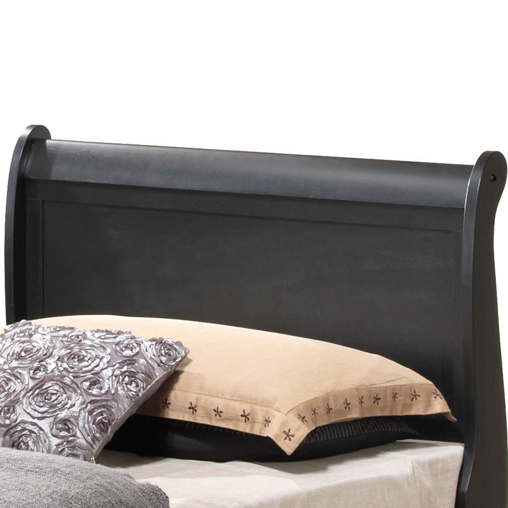 The Louis Phillipe - Storage Bed features a black wooden sleigh-style headboard, accented with a beige pillow and a floral-patterned pillow resting against it.