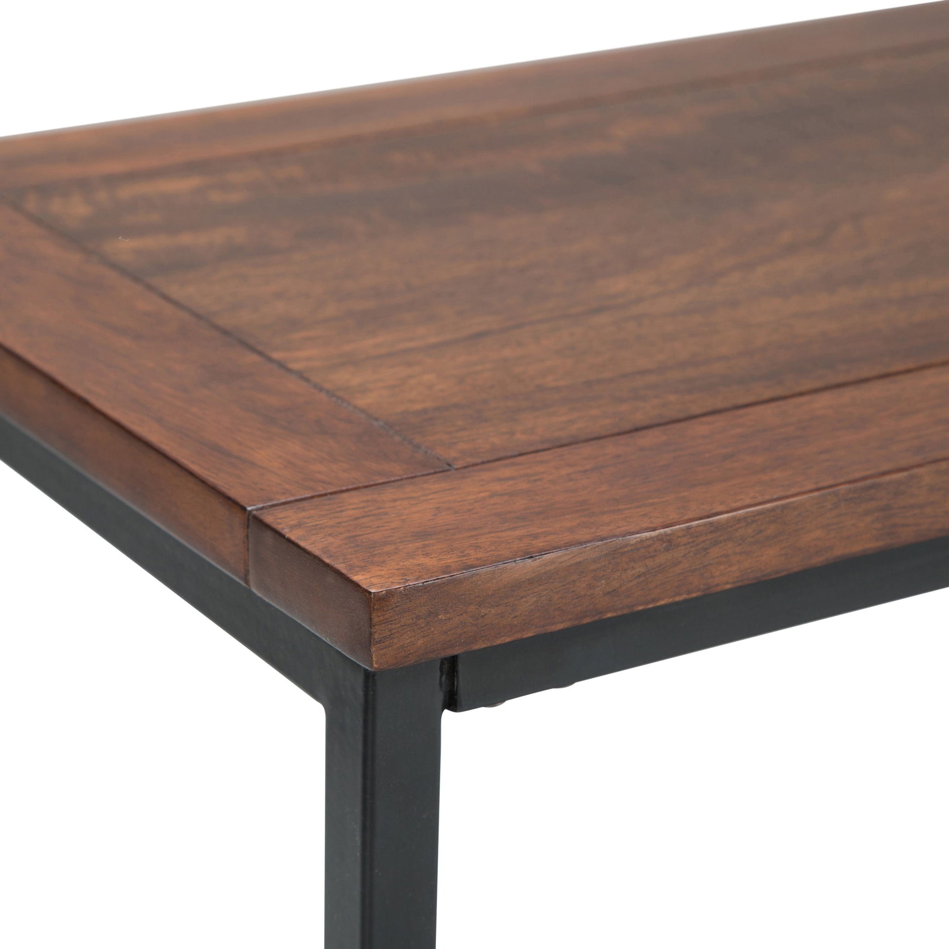 Close-up of the Skyler - Handcrafted Table corner, featuring a smooth dark brown wooden surface and black metal legs that highlight the wood grain and clean lines of the design.