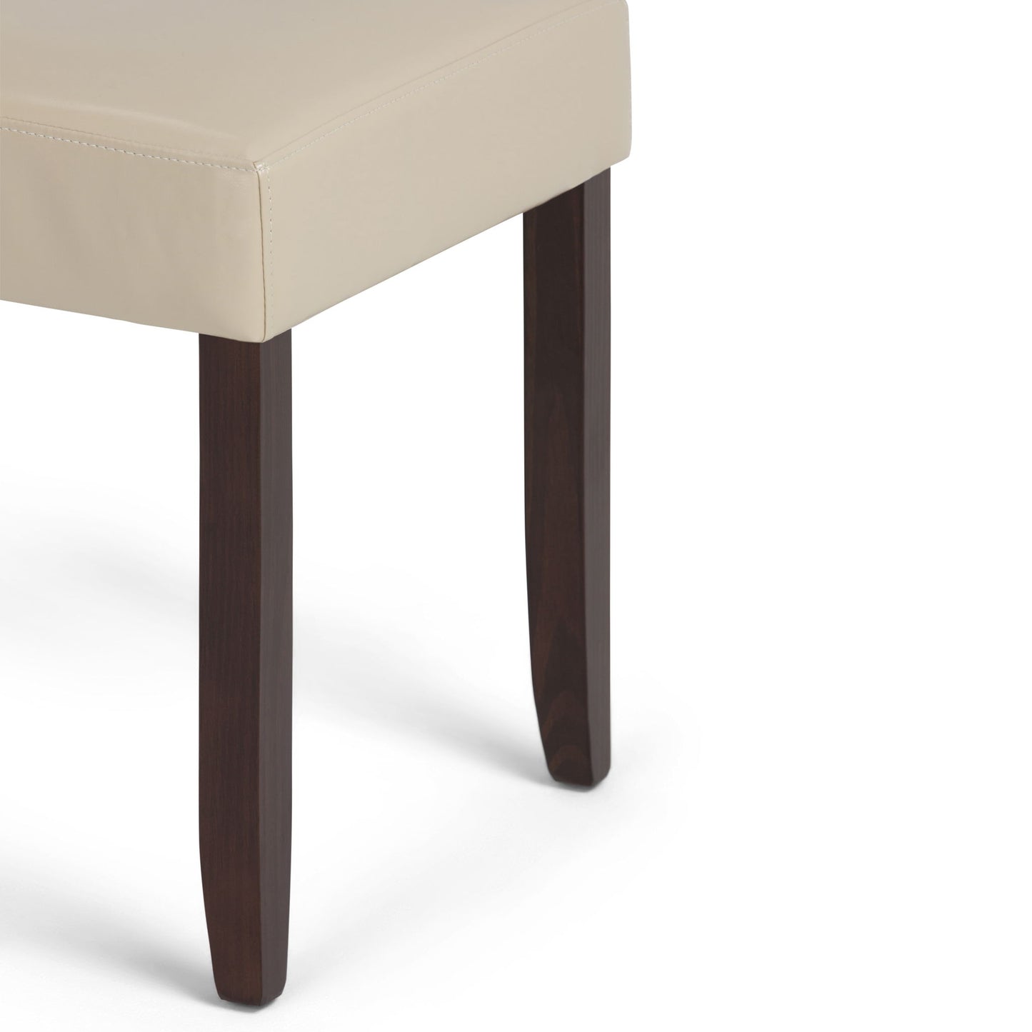 A close-up of the Acadian Upholstered Parson Dining Chair (Set of 2) features a beige cushioned seat and dark brown wooden legs against a white background.