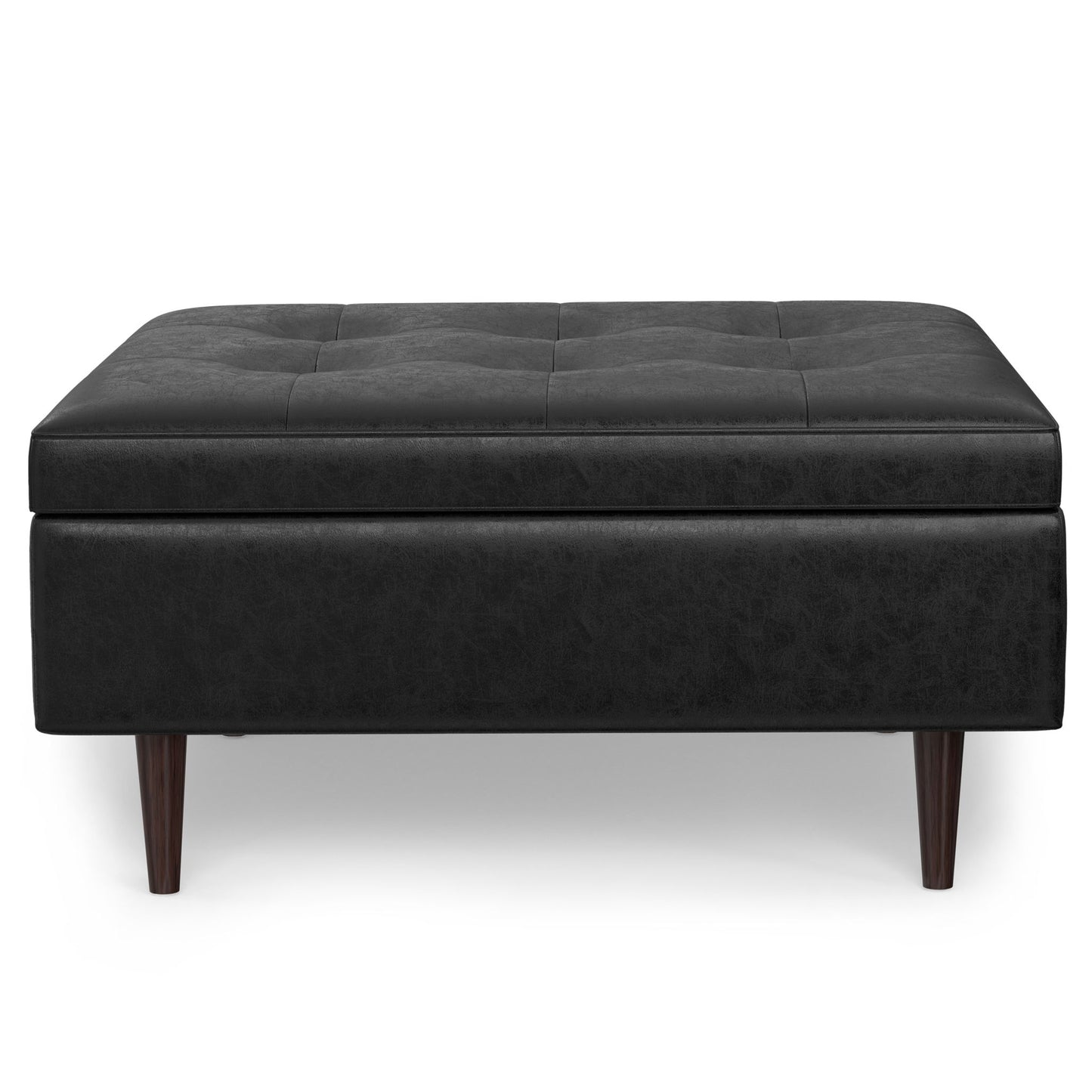 The Shay Large Square Coffee Table Storage Ottoman in black leather features a tufted top with subtle stitching, four wooden legs, and is shown from the front against a white background.