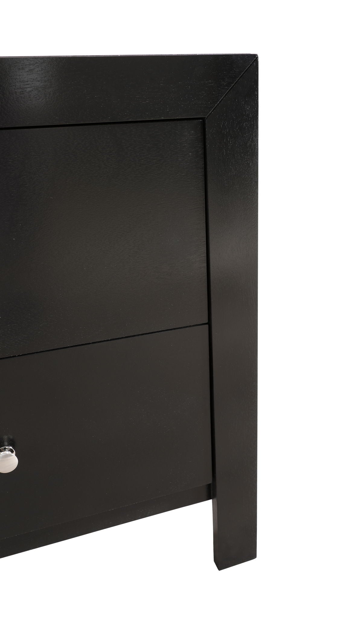 Close-up of the Charming Nightstand With Drawers, featuring a black wooden finish, part of a drawer with a metallic knob, set against a white background.