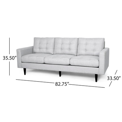The Jenny Contemporary Tufted Fabric 3 Seater Sofa features light gray upholstery, button-tufted back cushions, dark tapered legs, and measures 35.5" high, 33.5" deep, and 82.75" long.