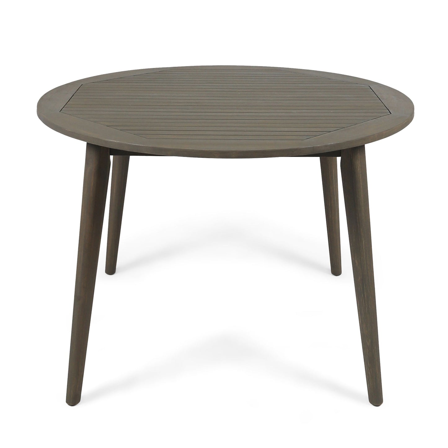 The Stamford Outdoor Dining Table features a round wooden slatted top and four angled legs, shown against a white background for a modern look.