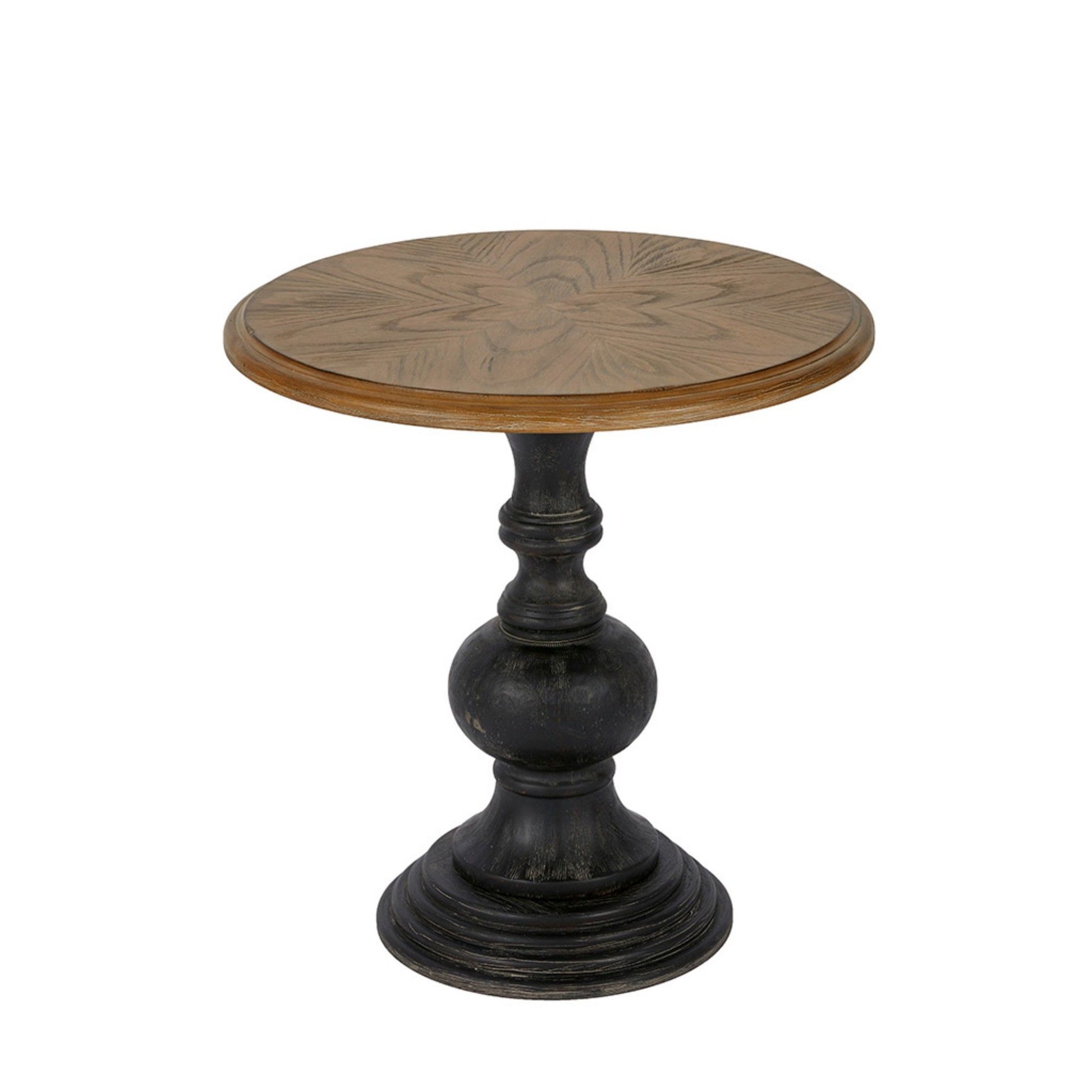 The Table With Reclaimed - Natural is a small round side table with a light wood top displaying a subtle starburst pattern and a dark, ornate pedestal base.