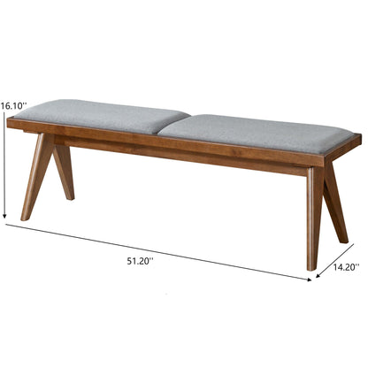 The Keira - Modern Aesthetics Bench features angled wooden legs, a cushioned gray seat, and measures 16.10" H x 51.20" W x 14.20" D.