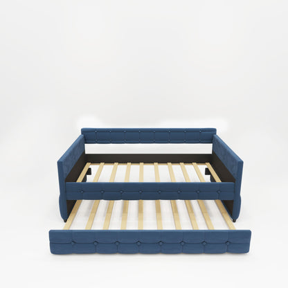 The Upholstered Twin Size Daybed Bed Frame (Corner Bed) features blue velvet fabric, studding design, back and side panels, wooden slats for support, and a pull-out trundle. Shown against a plain white background without mattress or bedding.