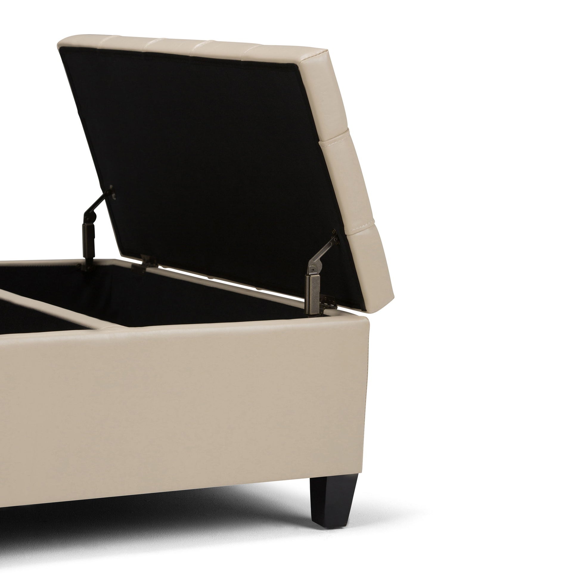 The Harrison Upholstered Coffee Table Storage Ottoman features a beige tufted lid that opens to reveal a spacious compartment. Its cushioned top and dark wooden legs combine comfort and style for versatile storage.