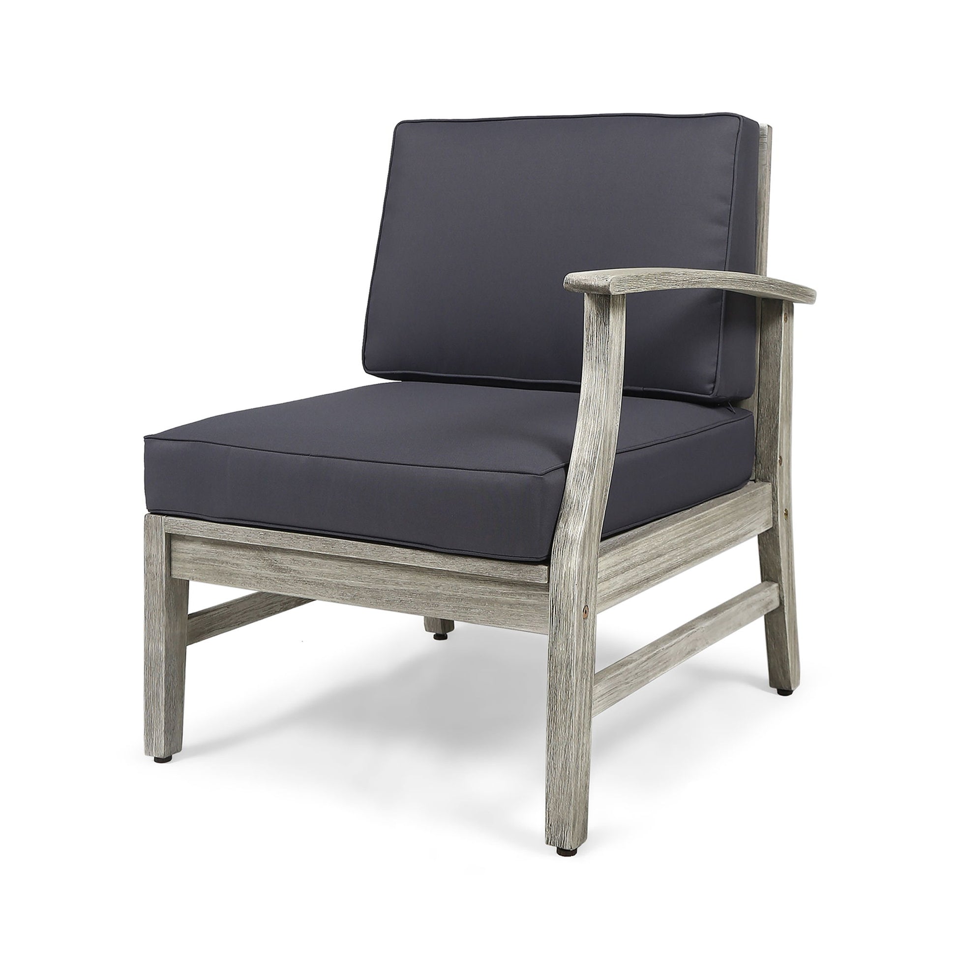 The Perla Armchair is a modern armless lounge chair featuring a weathered wooden frame and thick dark gray cushions on the seat and backrest, displayed against a white background.