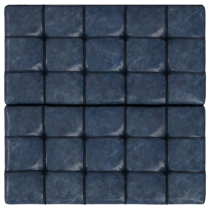 A close-up view of the Harrison Upholstered Coffee Table Storage Ottoman in dark blue leather, featuring a tufted grid pattern with seams and buttons. The leather has a slightly worn, textured look.