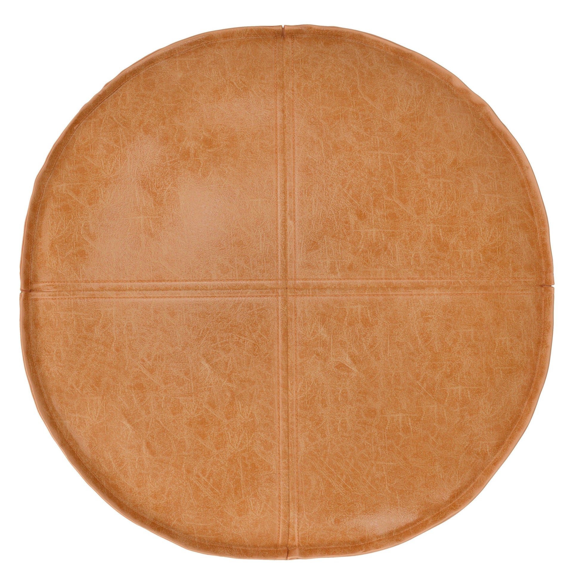 The Brody - Round Pouf is a tan leather cushion with subtle stitching dividing its surface into four sections, shown from above on a white background.