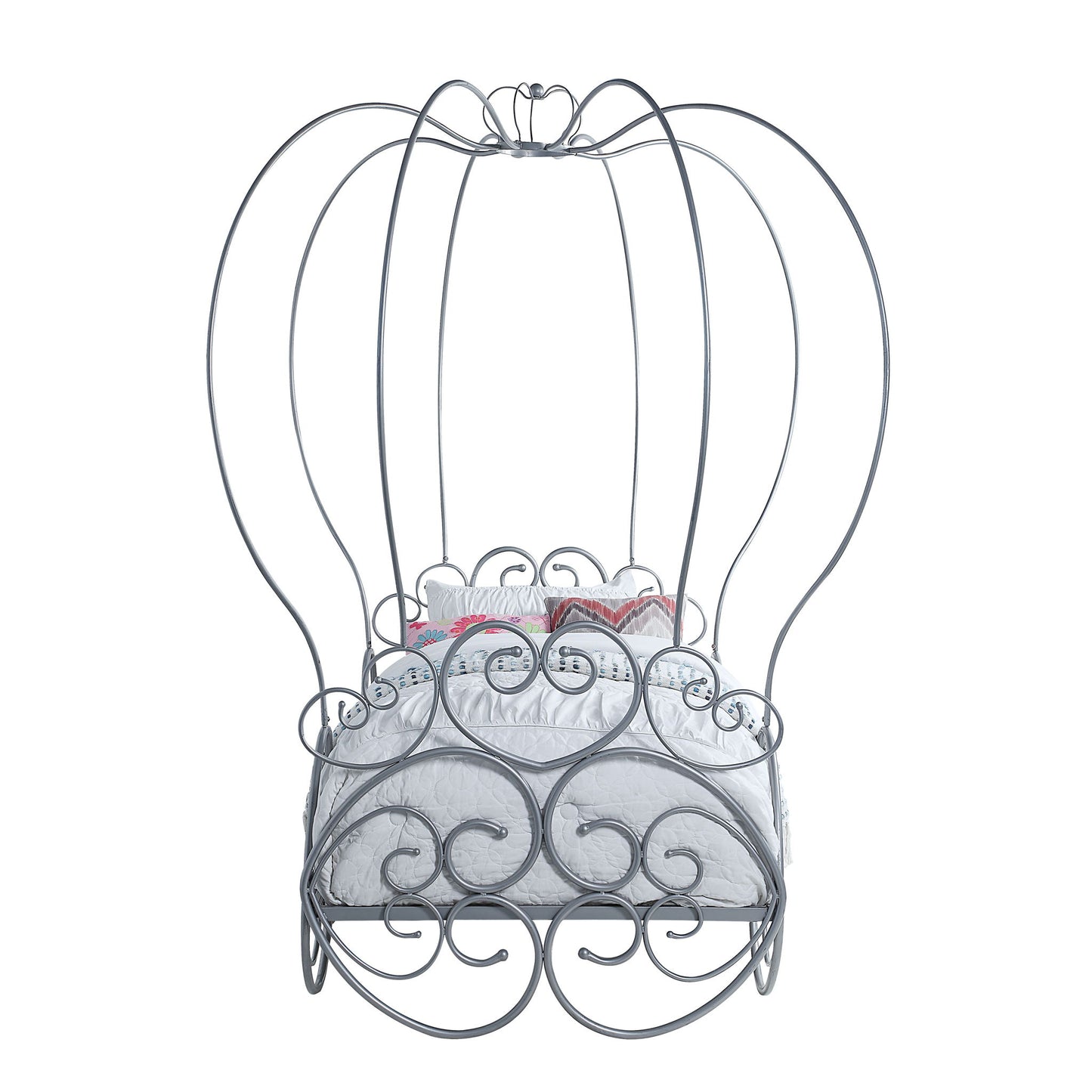 The Priya Twin Bed With Canopy in silver features ornate swirls and tall arches, designed like a whimsical carriage, and comes with a white mattress and decorative pillows.