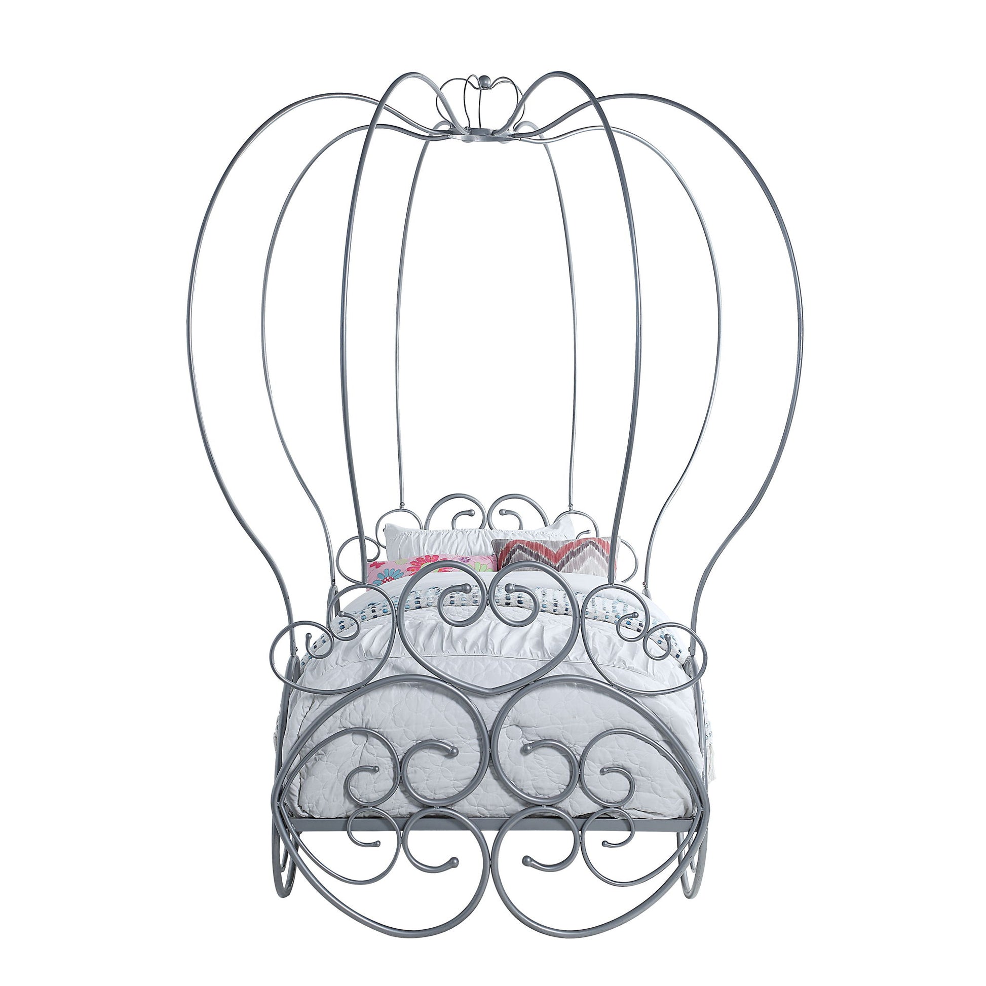 The Priya Twin Bed With Canopy in silver features ornate swirls and tall arches, designed like a whimsical carriage, and comes with a white mattress and decorative pillows.