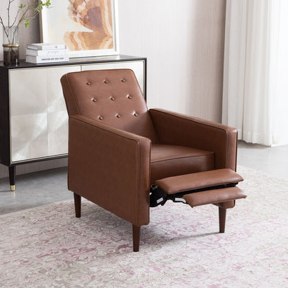The Mid-Century Modern Recliner With Button Tufted Waffle Stitch sits on a patterned rug in a modern living room, positioned next to a cabinet and curtain, its extended footrest completing the cozy setting.