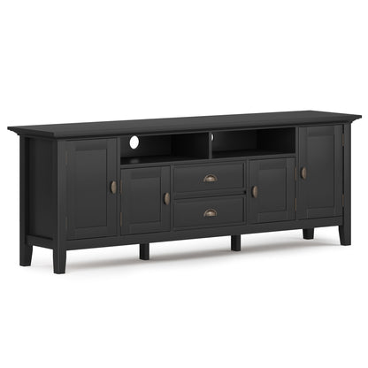 The Redmond Handcrafted TV Media Stand is a long black wooden unit with two end cabinets, two drawers, a small center cabinet, and two open shelves above, all accented with bronze handles.