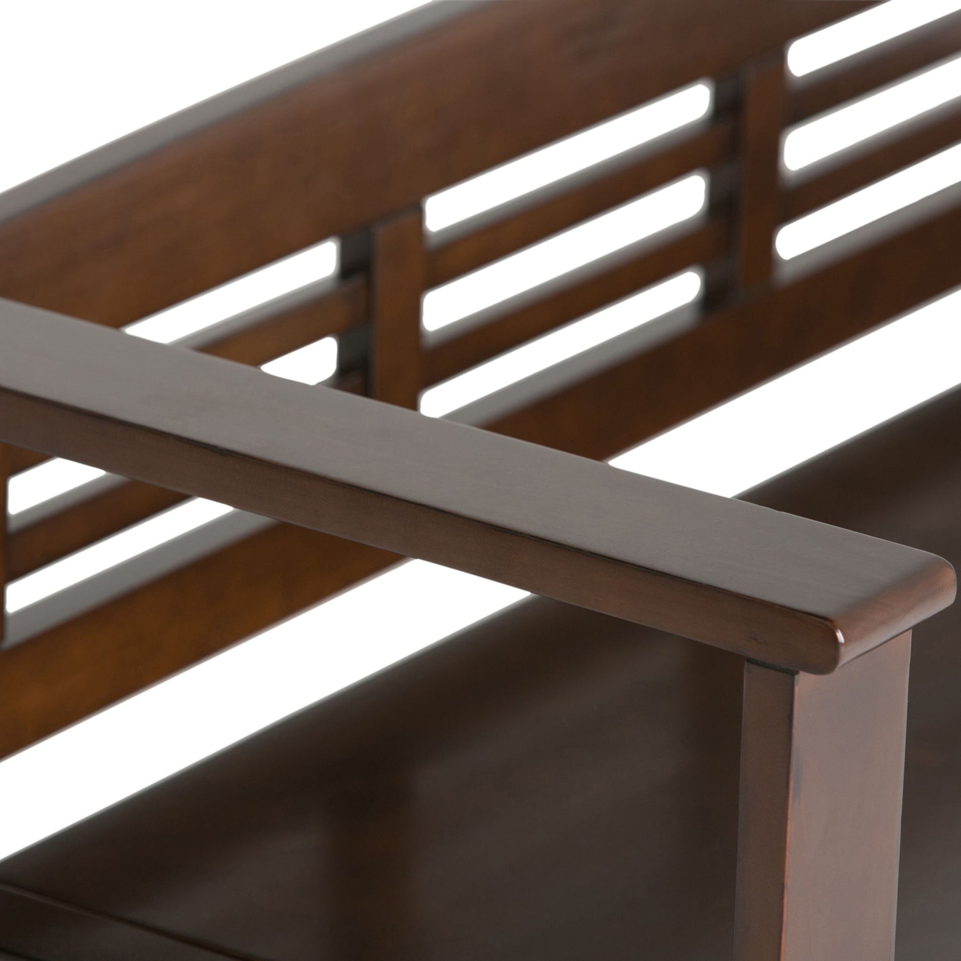 Close-up of the Adams - Entryway Storage Bench Handcrafted, highlighting its smooth, dark brown polished finish on the corner with a horizontal slat backrest and armrest.