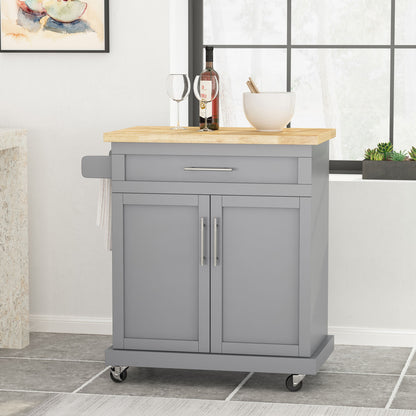 The Negley - Contemporary Kitchen Cart With Wheels in gray features a light wood top, drawer, two cabinet doors, silver handles, and a towel rack. A wine bottle, two glasses, and a white bowl sit on the cart.