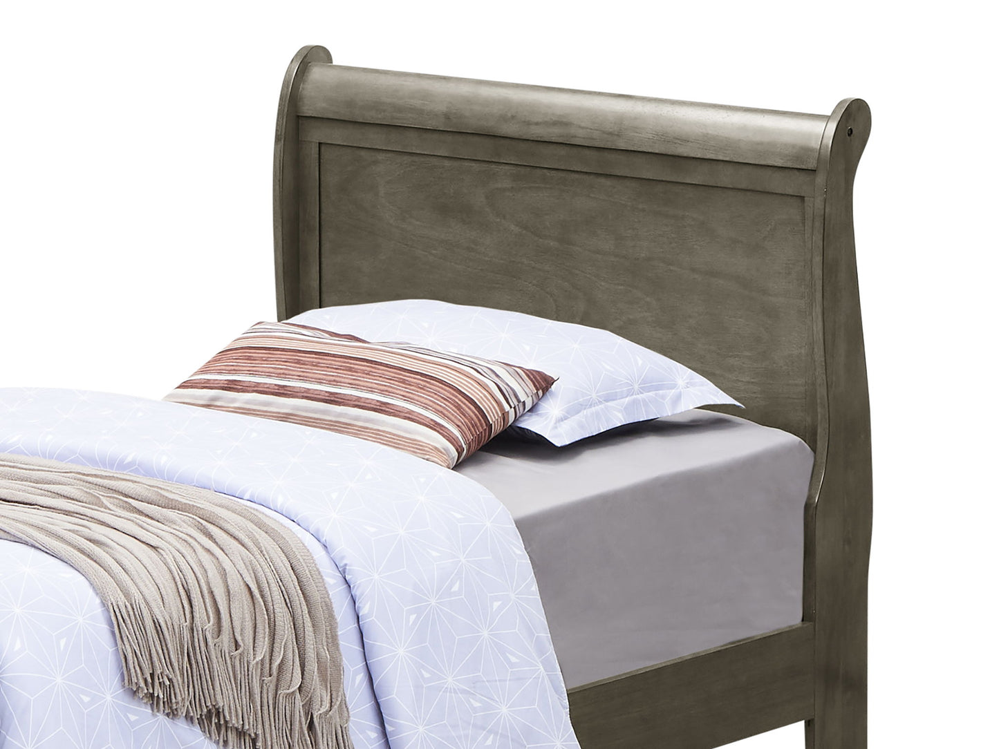 The Panel Sleigh Bed features a curved headboard, light gray sheets, a white patterned comforter, two pillows—one striped, one plain—and a folded beige blanket at the foot.