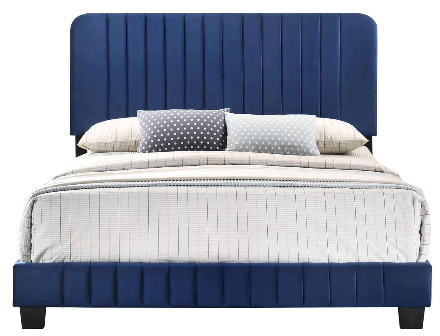 The Lodi - Bed features a tall, vertically paneled blue upholstered headboard and frame, paired with white and gray plaid bedding and three polka dot accent pillows in gray and light blue.