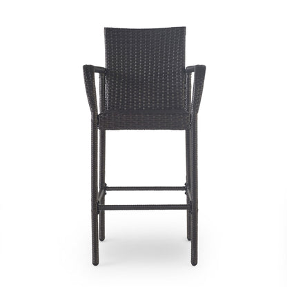 An Outdoor Wicker Barstool with rattan and an iron frame, featuring a tall design, armrests, and backrest, is shown from the front against a plain white background.