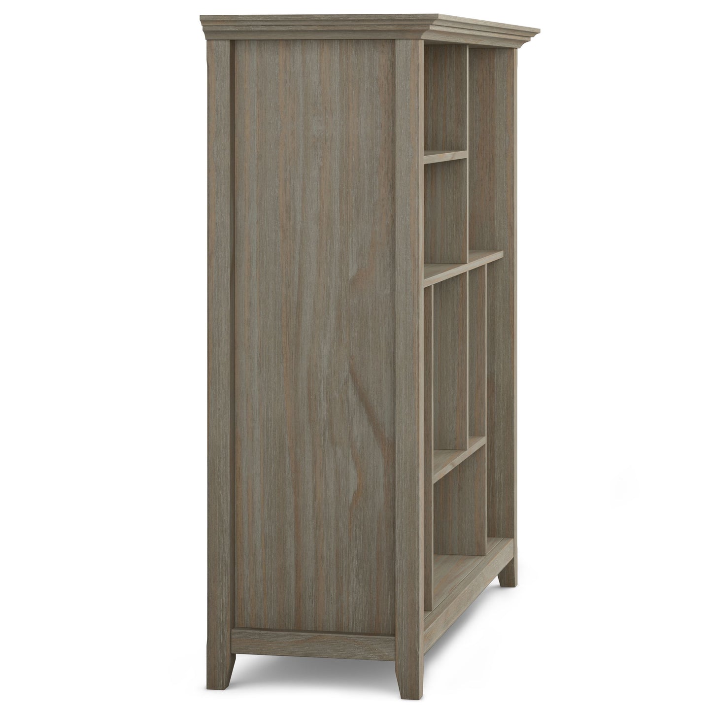 The Amherst - Multi Cube Bookcase And Storage Unit is shown from a side angle, featuring a weathered gray finish, multiple open shelves, and a slightly tapered base.