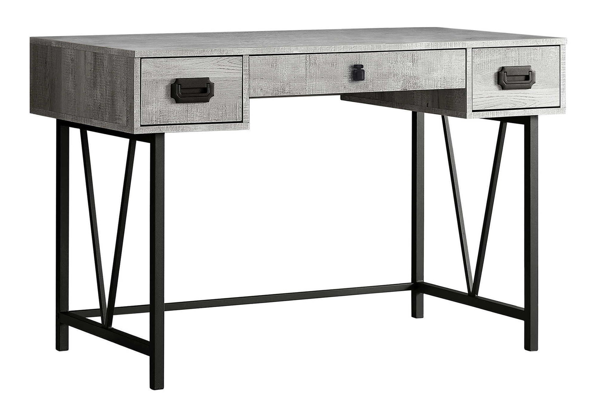 This transitional computer desk for home office or laptop use features a gray wood finish, three drawers with black handles, and black metal legs with angular supports for modern style and added storage.