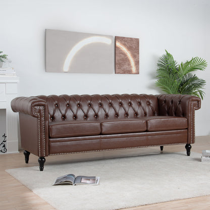 A Traditional Square Arm Removable Cushion 3 Seater Sofa in brown leather sits on a light rug in a modern living room featuring a plant, fireplace, abstract wall art, and an open magazine on the floor.