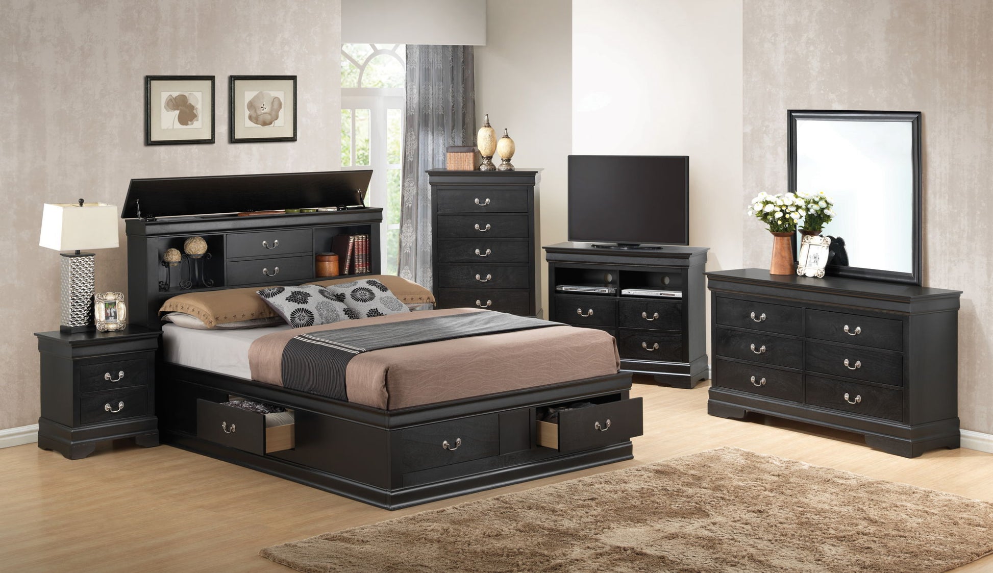 Modern bedroom with black Louis Phillipe Bookcase Storage Bed featuring storage drawers, two nightstands, dresser with mirror, TV stand, and tall chest. Neutral walls, artwork, and a beige rug add the finishing touches.