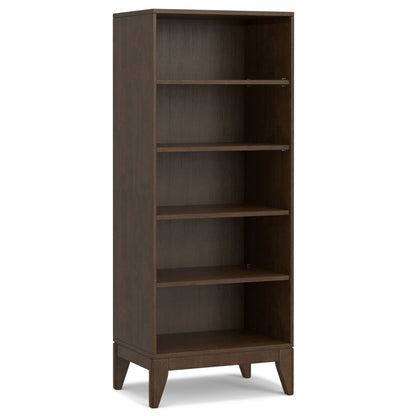 The Harper Handcrafted Bookcase With Storage is a tall, rectangular wooden shelf in a dark brown finish. It has four adjustable shelves, short angled legs, and features a simple, modern design.