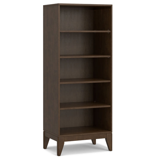 The Harper Handcrafted Bookcase With Storage is a tall, rectangular wooden shelf in a dark brown finish. It has four adjustable shelves, short angled legs, and features a simple, modern design.