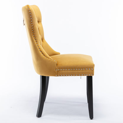 Side view of the Nikki modern velvet upholstered dining chair in mustard yellow, featuring button tufting, nailhead trim, and four dark wood legs; shown against a plain white background. Set of 2.