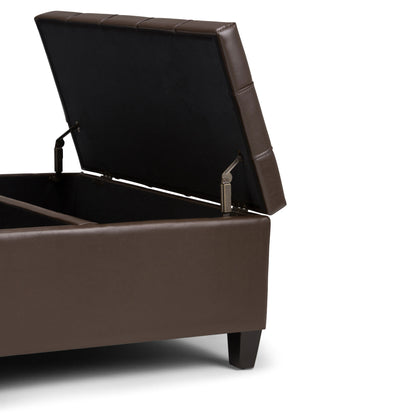 The Harrison Upholstered Coffee Table Storage Ottoman features a brown cushioned top, short dark wooden legs, and an open lid that reveals spacious interior storage.