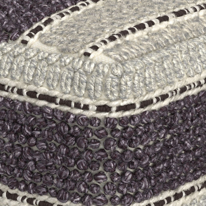 Close-up of the Grady - Handcrafted Square Pouf, highlighting its textured gray, cream, and dark purple fabric with a mix of looped and woven patterns, detailed stitching, and visible fibers at the corner.